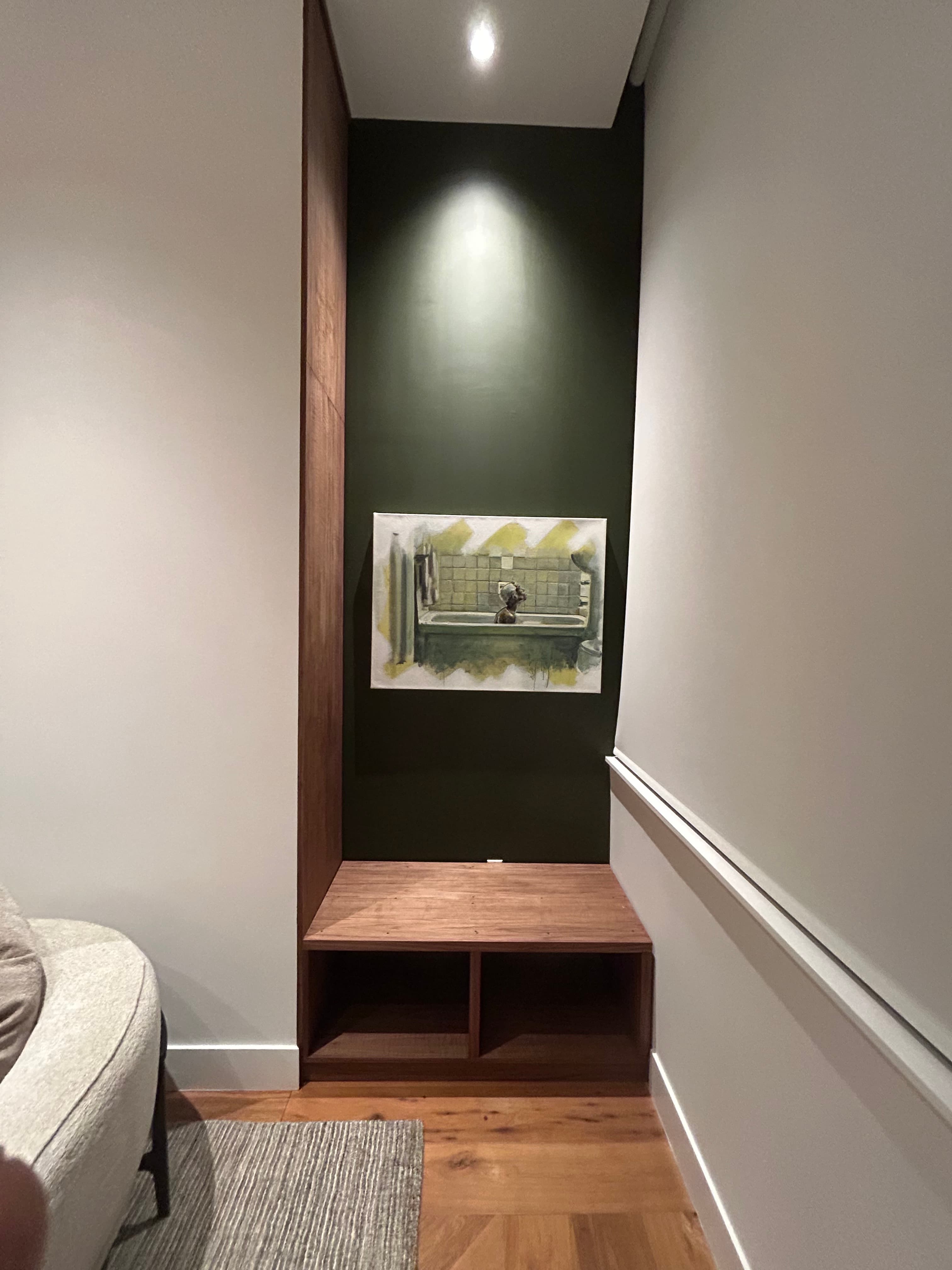 Custom built-in walnut floating shelf with reclaimed wood accent wall by Coastal Custom Woodworks