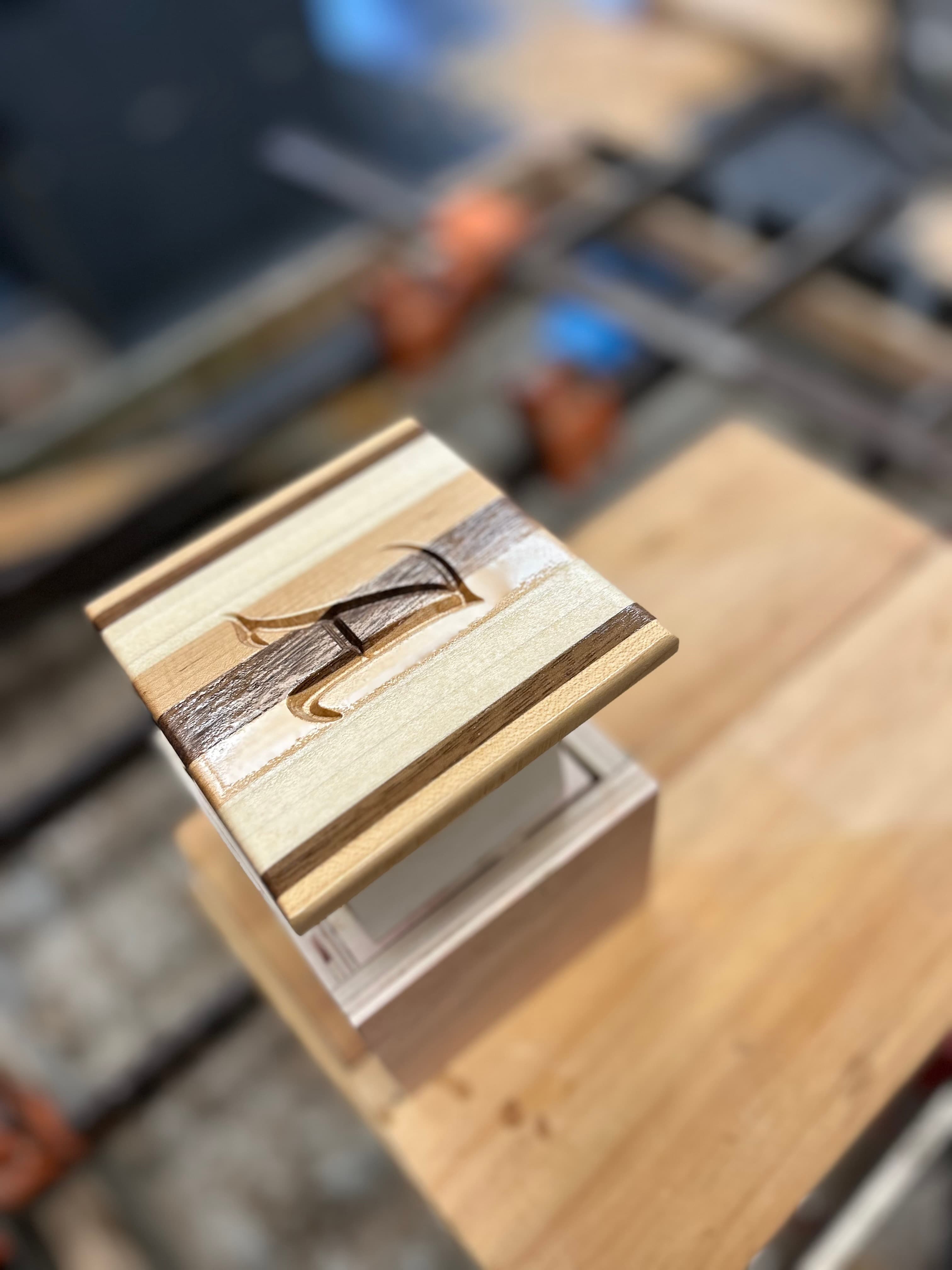CNC engraved monogram on a multi-wood block display piece