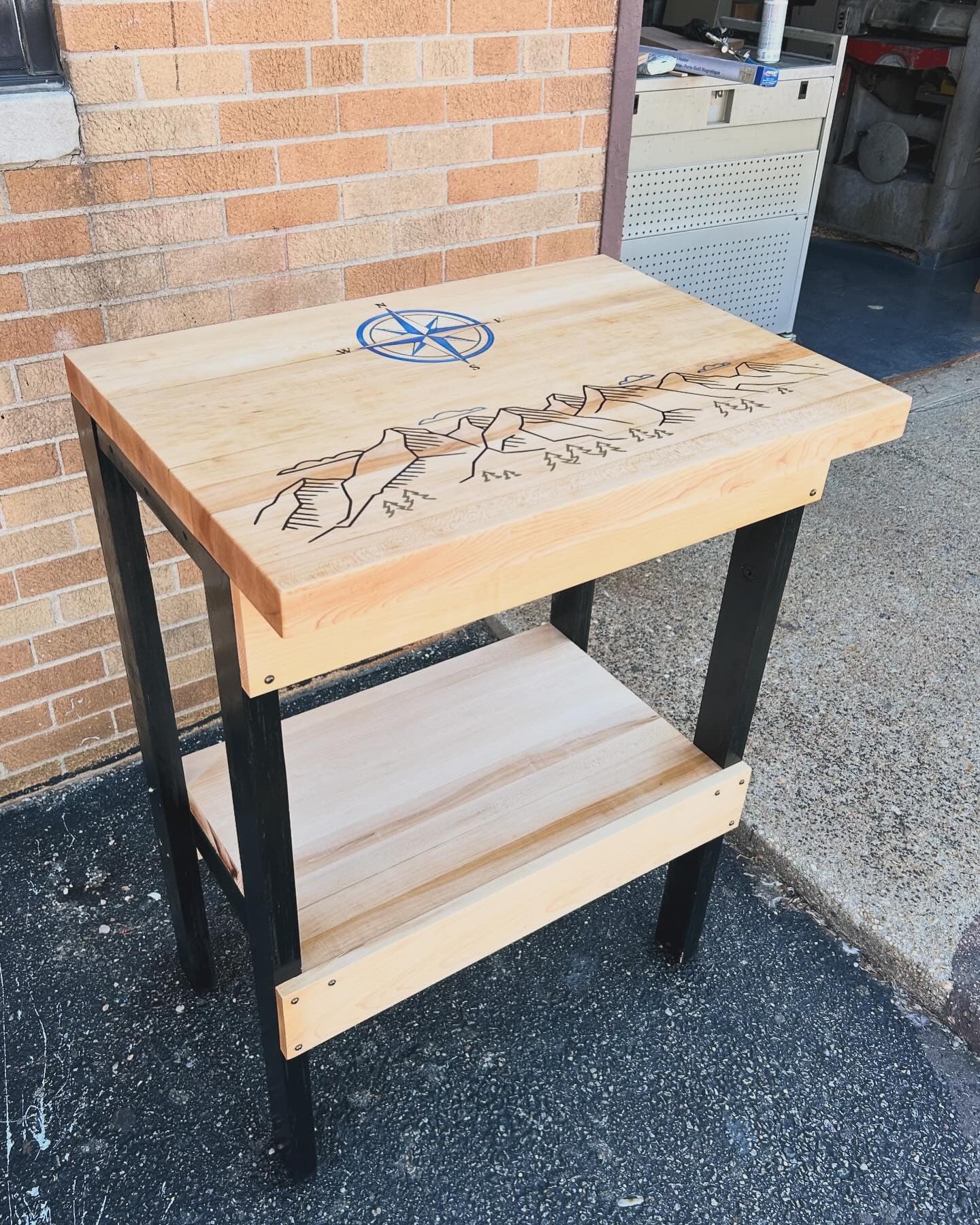 Custom side table with mountain scene engraving and metal legs