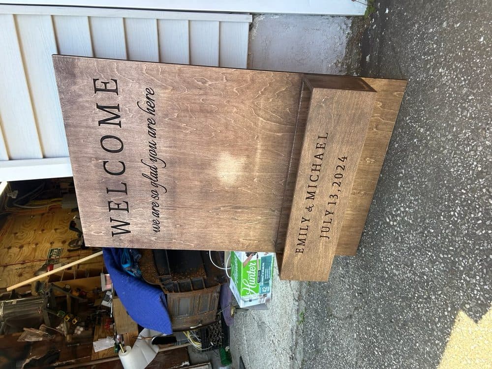 Custom wood wedding welcome sign with elegant calligraphy engraving