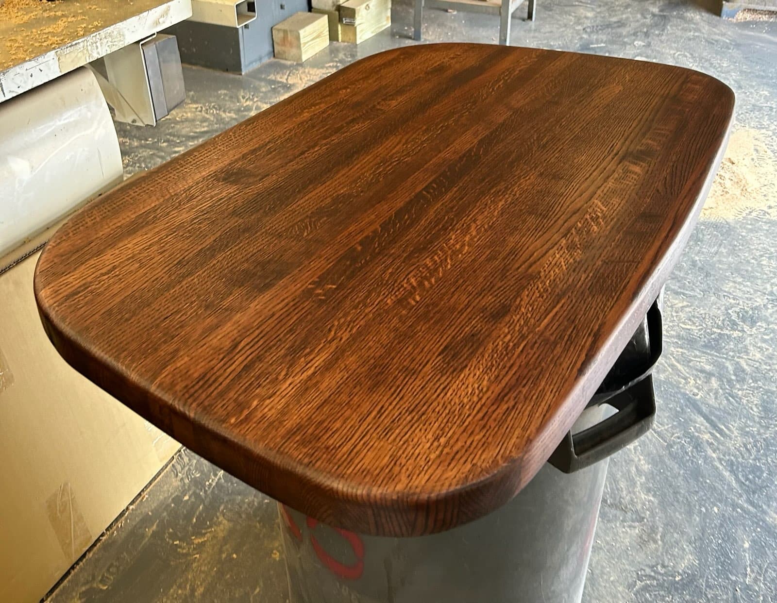 Dark stained oak rounded tabletop with smooth finish