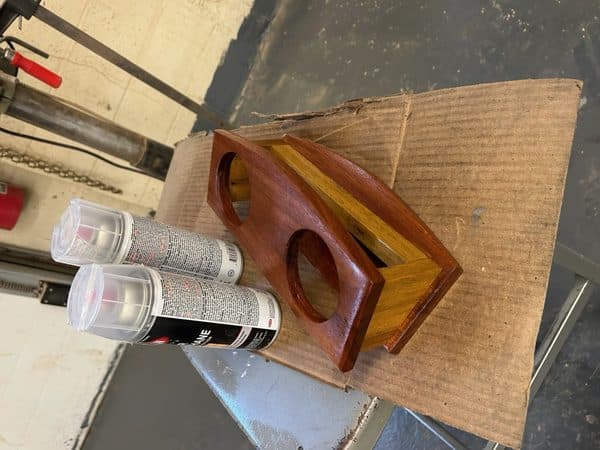 Handcrafted hardwood wine bottle holder with balanced design