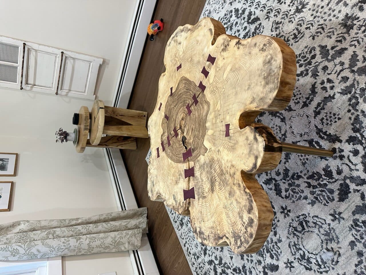 Live edge slab coffee table with butterfly joints and hairpin legs