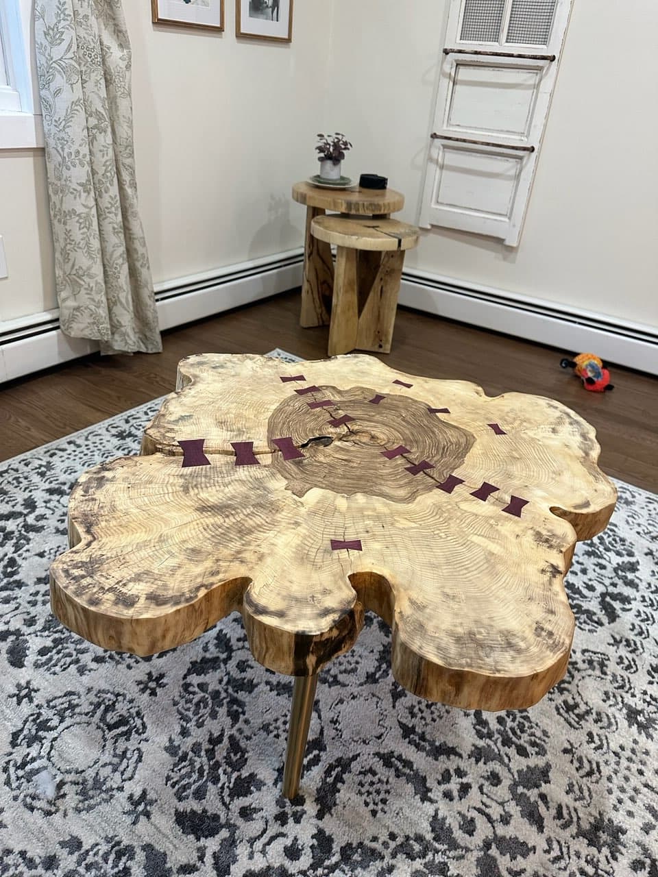 Live edge slab coffee table with butterfly joints and hairpin legs