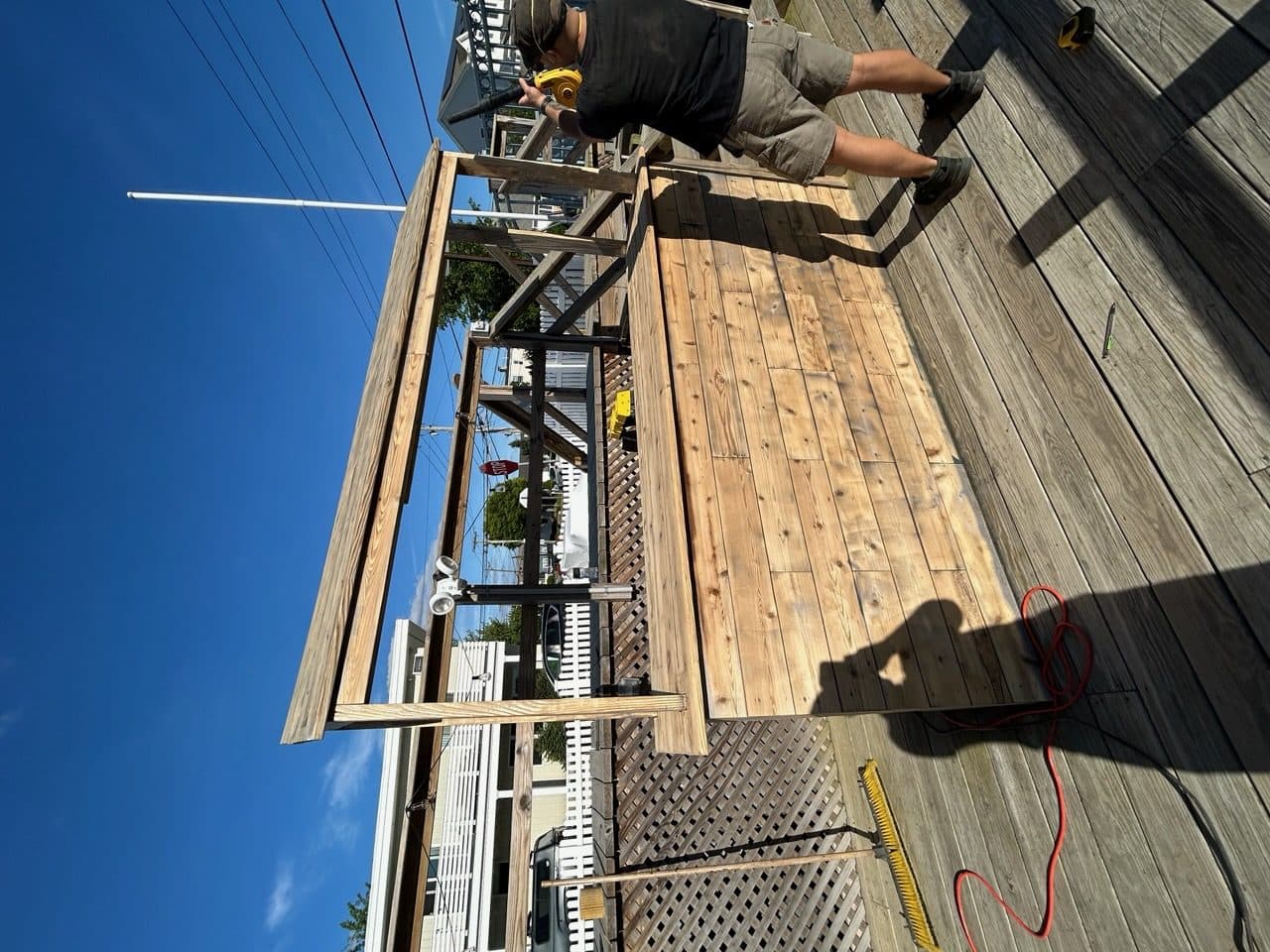 Outdoor dock bar built with reclaimed wood and metal frame