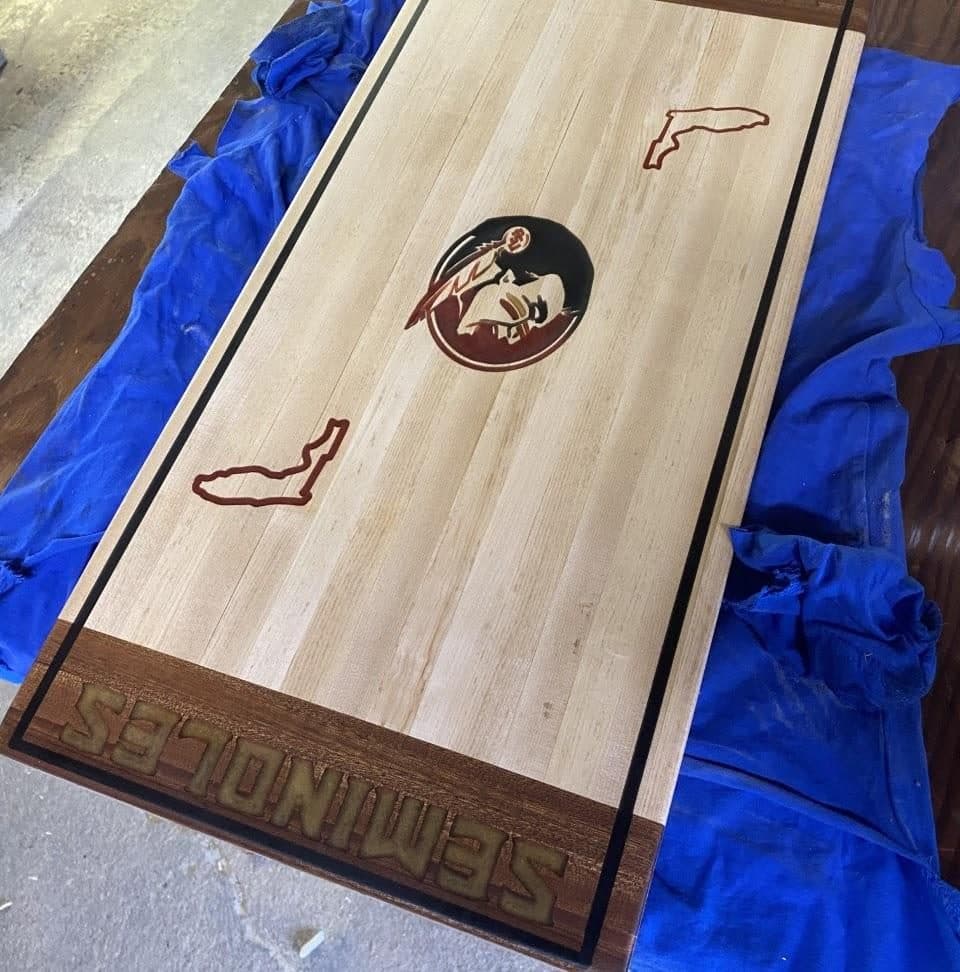 FSU Seminoles themed cornhole board with inlaid logo and Florida state outline