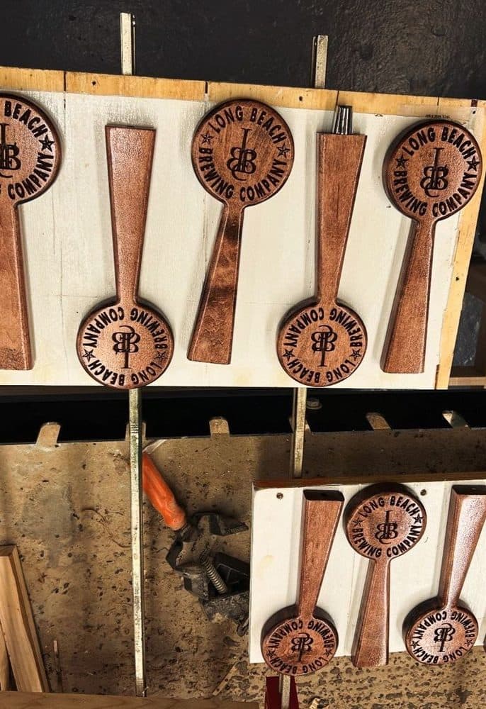 Set of custom Long Beach Brewing Company tap handles with round logo design