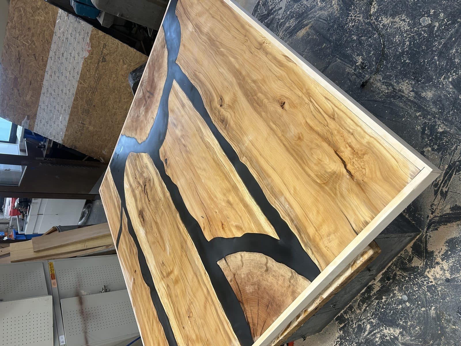 Spalted maple table top with black epoxy river running through the center